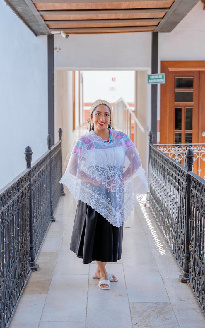 Woman in traditional Mexican clothing with a lace veil in Huauchinango, Puebla, México.